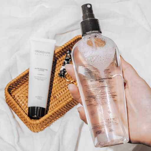 Nutri Hydrating Mist in hand with product in bg + 1080x1080.jpg