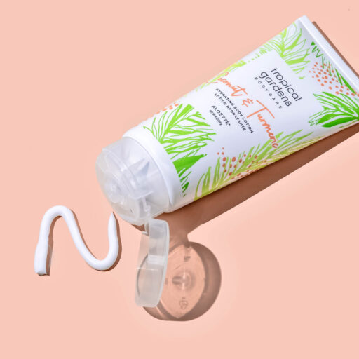 Coconut Tumeric Lotion + opened swatch + on peach.jpg