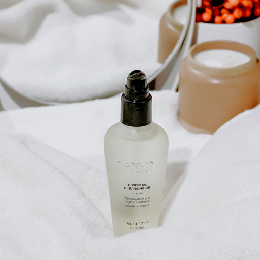 Essential Cleansing Oil + on lifestyle towel + 1080x1080.jpg